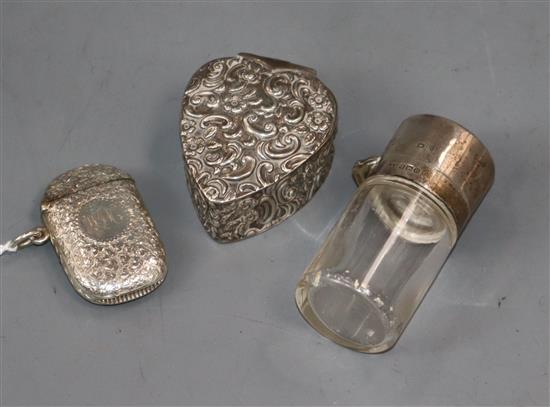 A George V silver and enamel salts bottle, a silver heart shaped box and a silver vesta case.